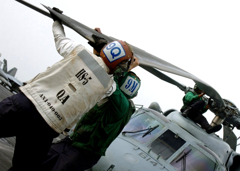 US Navy 070414-N-8907D-002 Sailors from the Nightdippers of Helicopter Anti-submarine Squadron (HS) 5 perform start-up checks on an SH-60F Seahawk aboard Nimitz-class aircraft carrier USS Dwight D. Eisenhower (CVN 69)