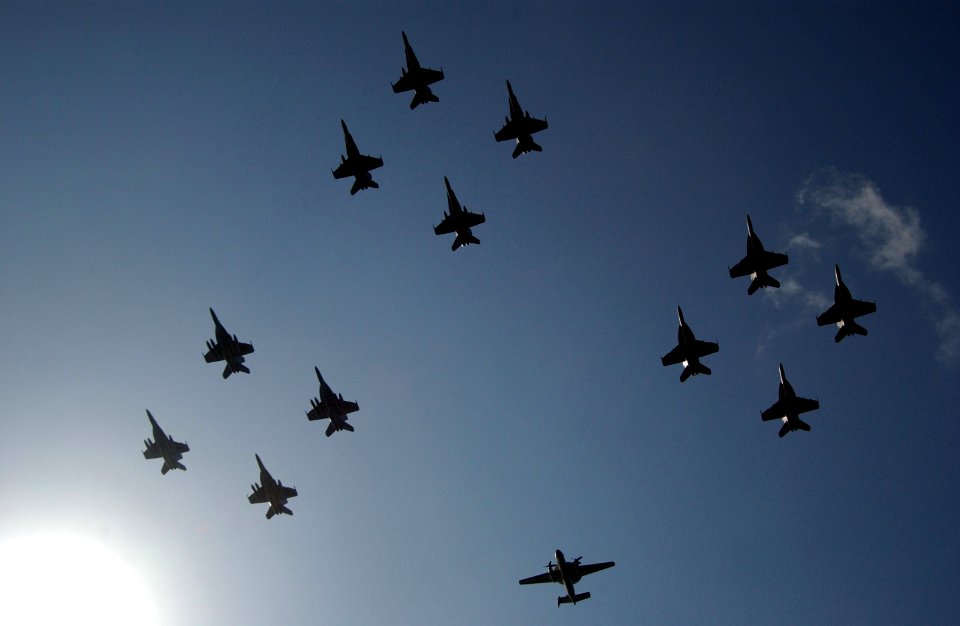 US Navy 070415-N-0555B-093 Aircraft assigned to Carrier Air Wing (CVW) 14 perform a fly-by above Nimitz-class aircraft carrier USS Ronald Reagan (CVN 76)