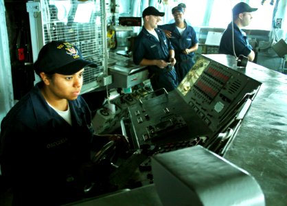 US Navy 070418-N-1328S-003 Seaman Cindy Osegueda steers amphibious assault ship USS Boxer (LHD 4) while underway in the Arabian Sea