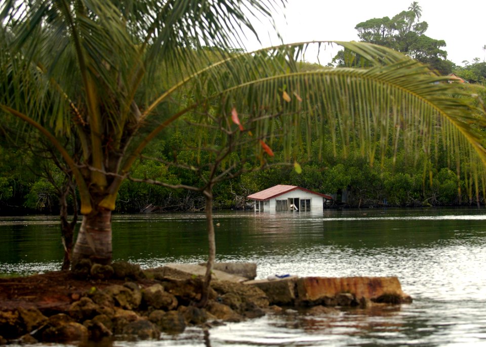 US Navy 070415-N-4790M-005 A submerged house shows the direct impact the recent earthquake and tsunami had on the island of Gizo