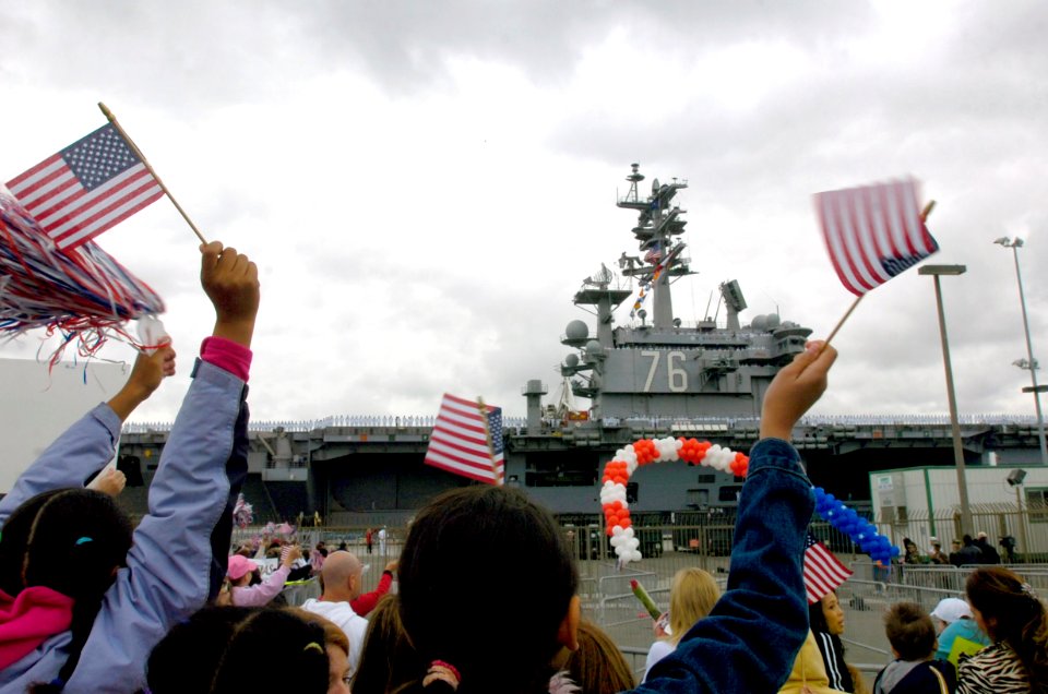 US Navy 070420-N-7130B-274 Families and friends cheer as USS Ronald Reagan (CVN 76) return home from deployment