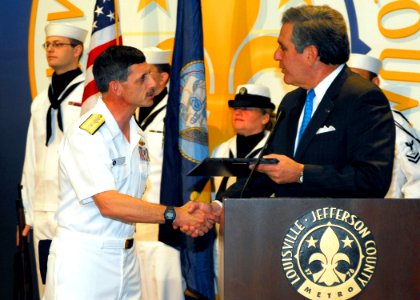 US Navy 070416-N-2903M-015 Louisville Mayor Jerry Abramsom presents Commander, Carrier Strike Group Two, Rear Adm. Michael C. Vitale with a plaque proclaiming April 16-21 to be Navy Week in the city of Louisville at City Hall