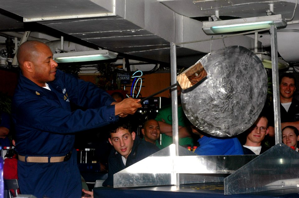 US Navy 070422-N-0890S-044 Chief Postal Clerk Kenneth Young gongs off a contestant during the Junior Enlisted Association's