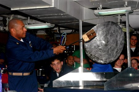 US Navy 070422-N-0890S-044 Chief Postal Clerk Kenneth Young gongs off a contestant during the Junior Enlisted Association's