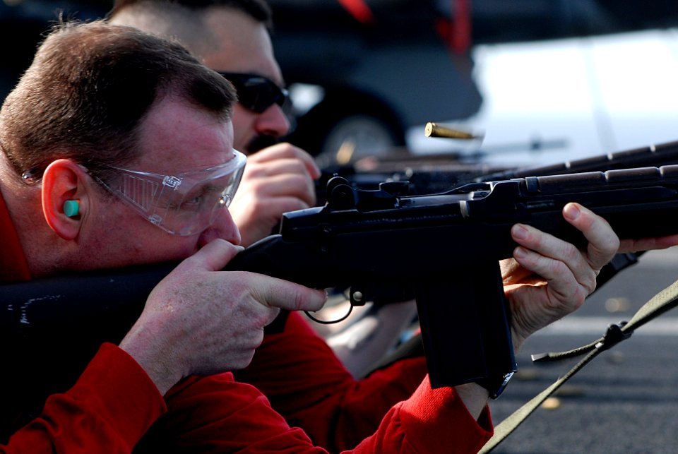 US Navy 070417-N-2659P-063 Lt. Jason Parmley, assigned to weapons department, fires an M-14 rifle during a live-fire exercise on the flight deck of Nimitz-class aircraft carrier USS John C. Stennis (CVN 74)