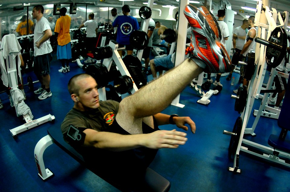 US Navy 070419-N-9760Z-053 Aviation Ordnanceman Airman Kirt Robinson works out during his free time in the gymnasium aboard the nuclear-powered aircraft carrier USS Nimitz (CVN 68)