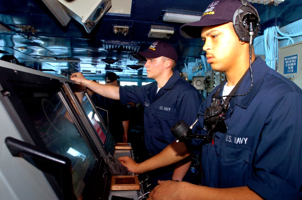 US Navy 070424-N-4420S-009 Seaman Josh Wilson stands watch as helm controlman aboard nuclear-powered aircraft carrier USS Nimitz (CVN 68)
