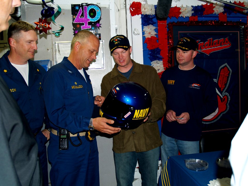 US Navy 070418-N-0000X-001 NASCAR driver and Navy Motorsports car owner Dale Earnhardt Jr. presents a helmet worn by Navy Motorsports car driver Shane Huffman to Commanding Officer Capt. Frank McCulloch