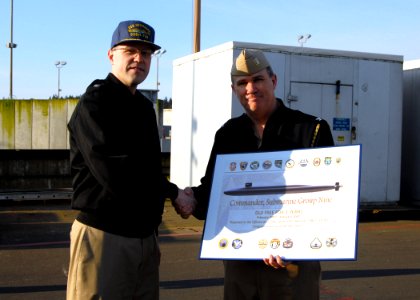 US Navy 070420-N-7656R-001 USS Nebraska (SSBN 739) (Blue) Commanding Officer receives an award from Chief of Staff Commander Submarine Group 9, Capt. Kenneth Walker for his crew staying DUI free for the past two years