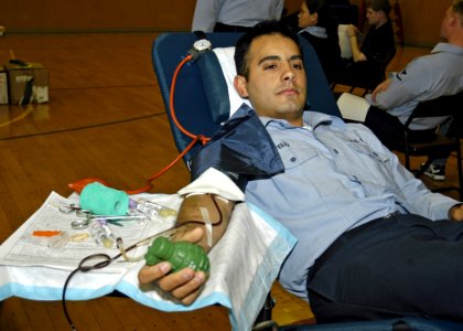 US Navy 070424-N-4649C-061 A Sailor donates blood during a blood drive sponsored by the Armed Services Blood Program held onboard Commander, Fleet Activities Yokosuka, Japan
