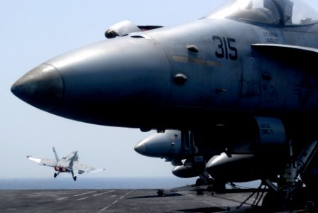US Navy 070421-N-2659P-145 An F-A-18C Hornet, from the Blue Diamonds of Strike Fighter Squadron (VFA) 146, launches from the flight deck of the Nimitz-class aircraft carrier USS John C. Stennis (CVN 74)