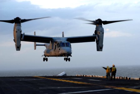 US Navy 070427-N-0841E-011 A V-22 Osprey from Marine Medium Tiltrotor Squadron (VMM) 162 practice touch and go landings to receive their deck landing qualification aboard the amphibious assault ship USS Kearsarge (LHD 3)