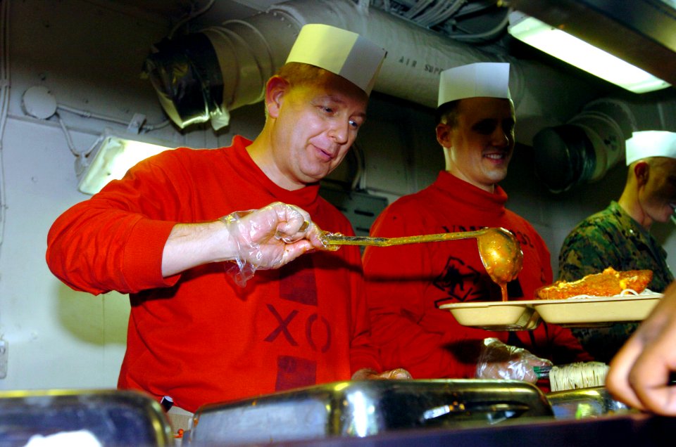 US Navy 070418-N-4420S-008 Capt. Brain Luther, executive officer of nuclear-powered aircraft carrier USS Nimitz (CVN 68), serves chow to Sailors aboard Nimitz