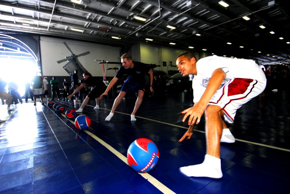 US Navy 070421-N-6326B-065 Sailors participate in a dodge ball tournament, sponsored by Morale, Welfare and Recreation (MWR), in the hangar bay aboard nuclear-powered aircraft carrier USS Nimitz (CVN 68)