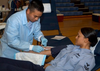 US Navy 070423-N-0483B-001 A Sailor donates blood to the Armed Services Blood Program at the Fleet Recreation Center on board Commander Fleet Activities Yokosuka