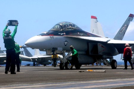 US Navy 070423-N-0890S-051 A flight deck Sailor verifies the weight of an F-A-18F Super Hornet, assigned to the Black Aces of Strike Fighter Squadron (VFA) 41, prior to launch aboard nuclear-powered aircraft carrier USS Nimitz