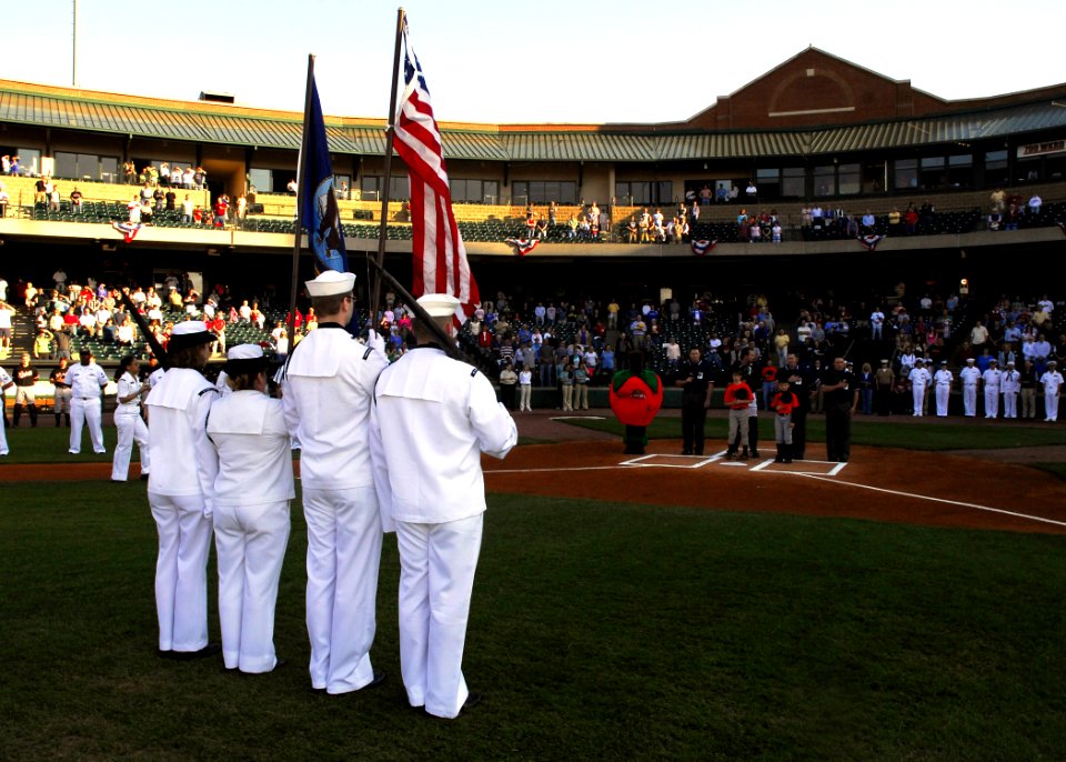 US Navy 070420-N-2903M-007 An honor guard from Navy Operational Support Center Louisville presents the National Colors before the start of a minor league baseball game between the Louisville Bats and Norfolk Tides