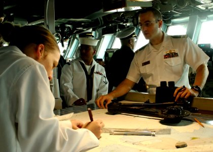 US Navy 070429-N-1328S-001 Sailors aboard the amphibious assault ship USS Boxer (LHD 4) plot the ship's course as they pull into Fremantle for a port visit during their Western Pacific deployment