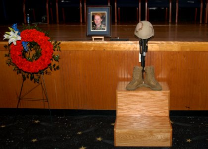 US Navy 070430-N-6247M-001 A memorial service is held in the base theater on Naval Air Station Whidbey Island in honor of three Explosive Ordnance Disposal Unit members that lost their lives in Iraq, April 6, 2007 photo