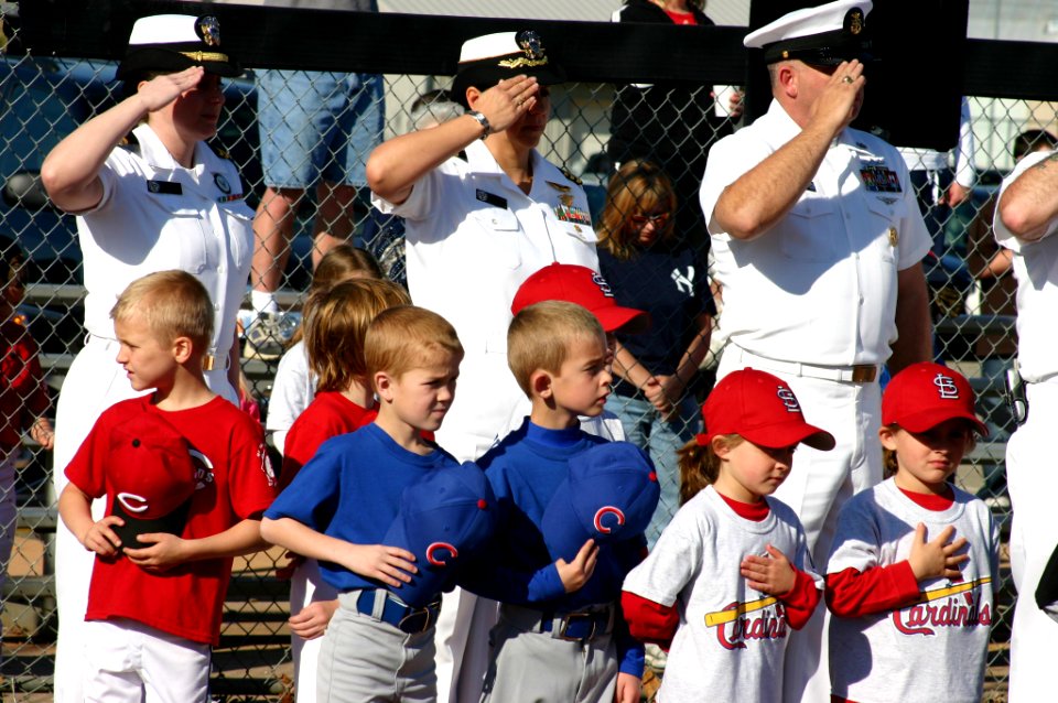 US Navy 070421-N-7163S-002 Little League players from the Mount Washington Youth Baseball-Softball Association and Sailors from Navy Recruiting District salute the flag during a ceremony to dedicate the seven- and eight-year-ol