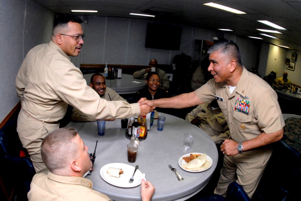 US Navy 070501-N-0696M-180 Master Chief Petty Officer of the Navy (MCPON) Joe R. Campa Jr. greets chief petty officers assigned to USS Wasp (LHD 1) in the CPO mess of the multipurpose amphibious assault ship
