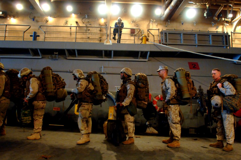 US Navy 070421-N-9818V-045 Marines attached to the 26th Marine Expeditionary Unit (MEU) based out of Camp Lejeune, N.C., board a landing craft utility (LCU) assigned to Assault Craft Unit (ACU) 2
