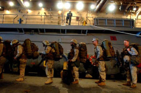 US Navy 070421-N-9818V-045 Marines attached to the 26th Marine Expeditionary Unit (MEU) based out of Camp Lejeune, N.C., board a landing craft utility (LCU) assigned to Assault Craft Unit (ACU) 2