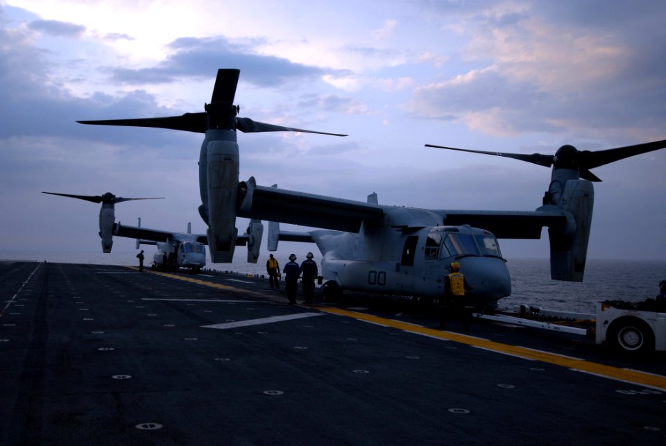 US Navy 070427-N-0841E-015 Two V-22 Ospreys from Marine Medium Tiltrotor Squadron (VMM) 162 sit on the deck after completing touch and go landings