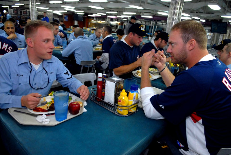 US Navy 070501-N-3659B-245 Aviation Electronics Technician 3rd Class Erick Bloom eats lunch with Washington Nationals' pitcher Jon Rauch on the mess decks of USS Ronald Reagan (CVN 76)