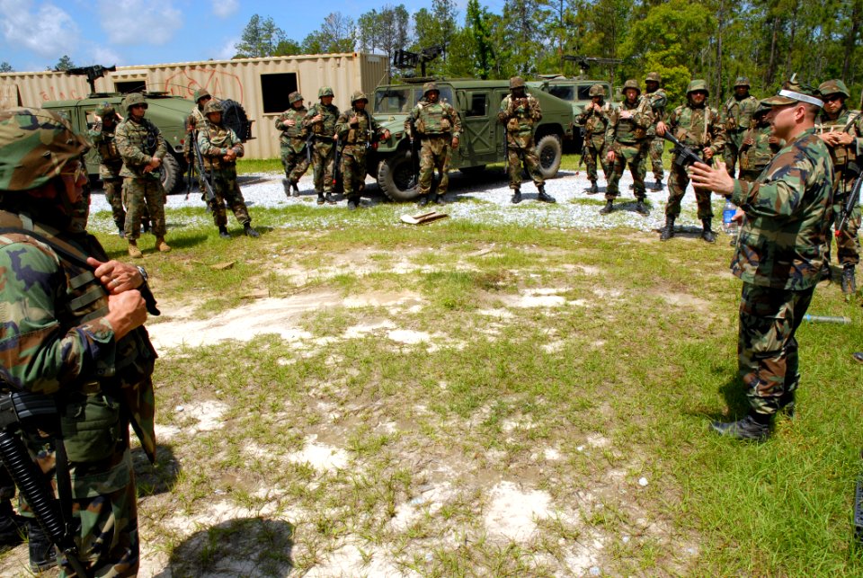 US Navy 070427-N-7367K-004 Chief Utilitiesman Tim Hittle, the R75 convoy security team military operation urban terrain (MOUT) chief petty officer, briefs U.S. Naval Mobile Construction Battalion (NMCB) 1