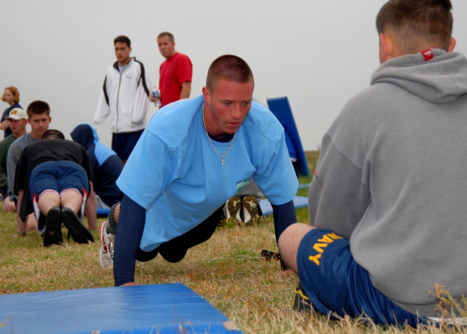 US Navy 070426-N-4459K-087 Electrician's Mate 2nd Class Mark E. Ward performs pushups as part of PCU GEORGE H. W. BUSH (CVN 77) 2007 Spring Physical Fitness Assessment