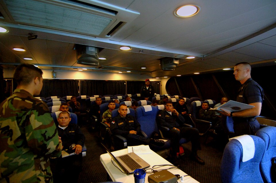 US Navy 070502-N-0989H-037 BM2 Thomas Williams, United States Coast Guard International Training Division, provides training on cargo container inspections to Servicio Maritimo Nacional de Panama and Policia Nacional de Panama