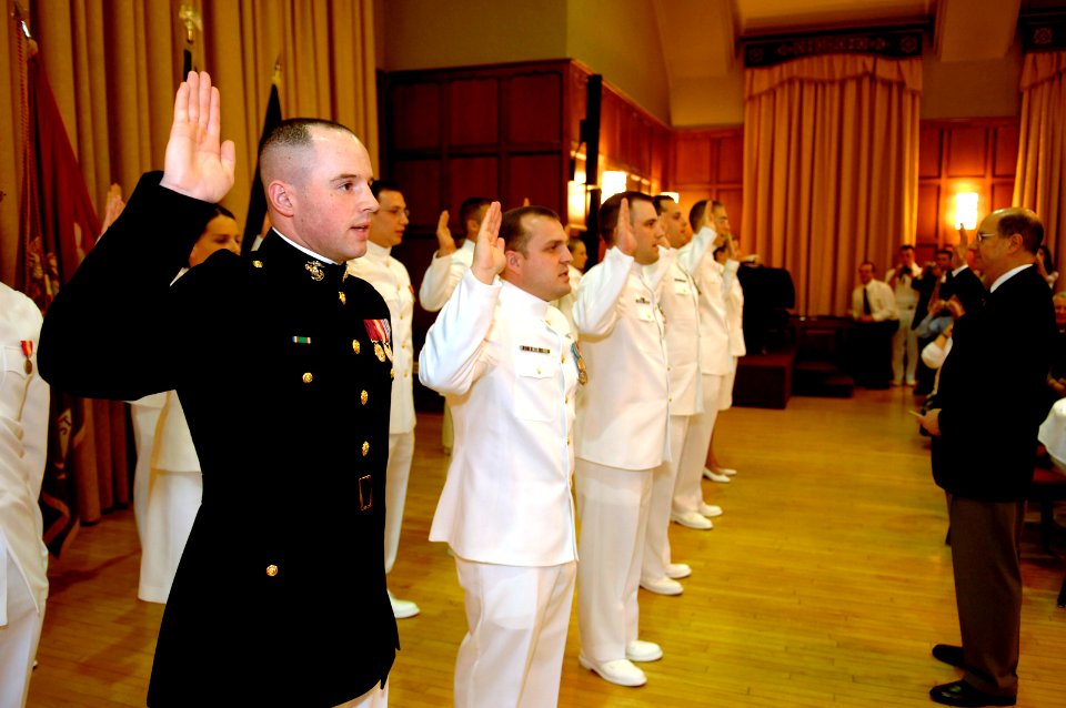 US Navy 070427-N-3642E-009 2nd Lt. Mike White, recites the oath of office from Secretary of the Navy (SECNAV), the Honorable Dr. Donald C. Winter during a commissioning ceremony