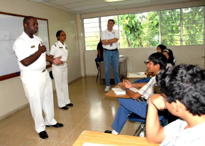 US Navy 070502-N-9486C-001 Hospital Corpsman 1st Class Charles Givens, Commander Task Group 40.9 Independent Duty Corpsman, explains his military decorations to the students at Colegio International Del Caribe international sch