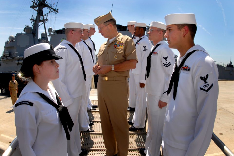 US Navy 070501-N-0696M-261 Chief of Naval Operations (CNO) Adm. Mike Mullen visits with side boys after being piped aboard USS Monterey (CG 61) at Naval Station Norfolk