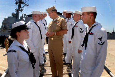 US Navy 070501-N-0696M-261 Chief of Naval Operations (CNO) Adm. Mike Mullen visits with side boys after being piped aboard USS Monterey (CG 61) at Naval Station Norfolk