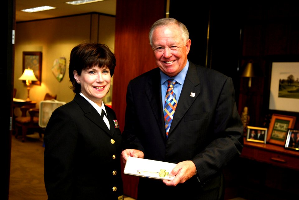 US Navy 070430-N-3271W-002 Rear Adm. Karen Flaherty, Deputy Commander, Navy Medicine, National Capital Area, receives a key to the city from Omaha Mayor Mike Fahey at a signing ceremony