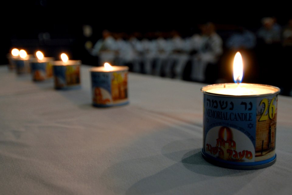 US Navy 070426-N-4965F-003 Six memorial candles are lit during a Holocaust Remembrance Day ceremony at Sharkey Theater on board Naval Station Pearl Harbor