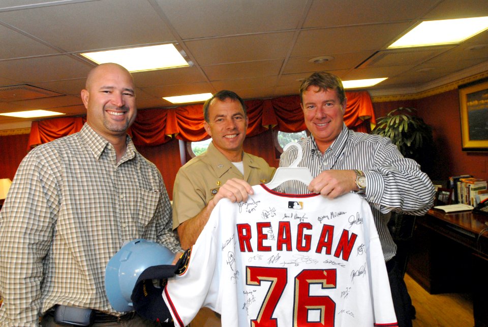 US Navy 070501-N-7730P-040 In the captain's in-port cabin on board USS Ronald Reagan (CVN 76), players from the Washington Nationals baseball team present a game jersey with Reagan's name and hull number