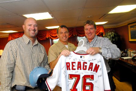 US Navy 070501-N-7730P-040 In the captain's in-port cabin on board USS Ronald Reagan (CVN 76), players from the Washington Nationals baseball team present a game jersey with Reagan's name and hull number