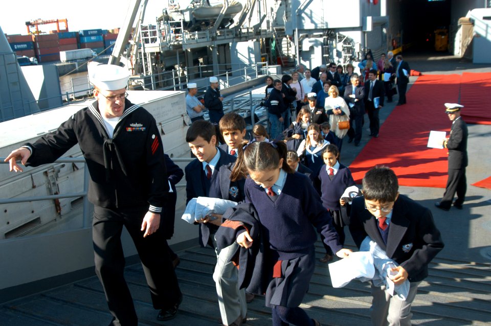 US Navy 070427-N-7029R-163 Electrician's Mate Fireman Jessy Gappa gives a tour to a youth group from Stella Maris in Buenos Aires aboard USS Pearl Harbor (LSD 52)