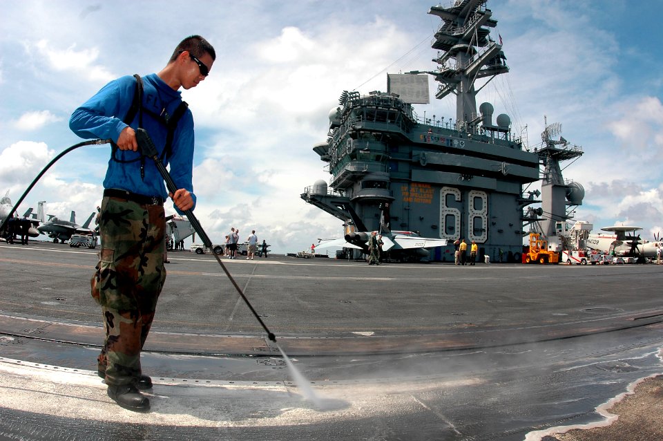 US Navy 070501-N-9760Z-033 Aviation Boatswain's Mate Handling Airman Philip Baker uses a pressure washer to clean the flight deck