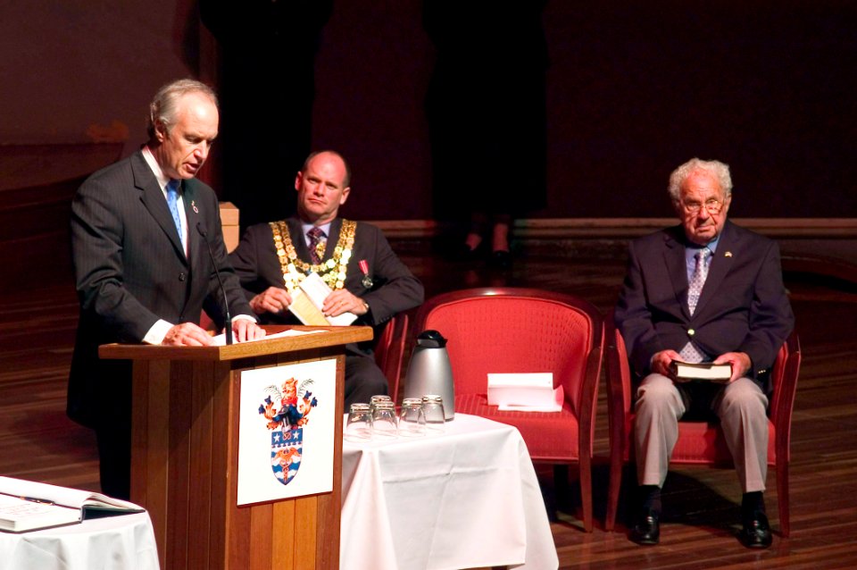 US Navy 070505-N-5253W-015 USS Lexington survivor Hilliard Elliot, right, and Lord Mayor of Brisbane Campbell Newman listen as U.S. Secretary of the Interior Dirk Kempthorne addresses the audience during the 65th Commemoration