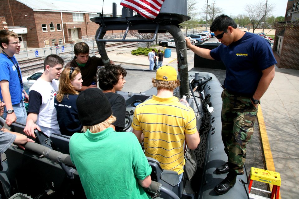 US Navy 070502-N-3271W-004 Special Warfare Boat Operator 2nd Class Andrew Everett gives students of Thomas Jefferson High School a tour on the Swift Boat that was displayed at the school