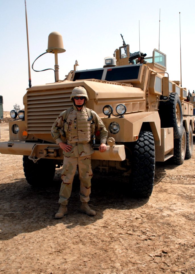 US Navy 070506-N-3560G-006 Equipment Operator 3rd Class Jacob Stahl, assigned to Naval Mobile Construction Battalion (NMCB) 4, Convoy Security Element, prepares to mount out with the Mine Resistant Ambush Protected (MRAP) Armor