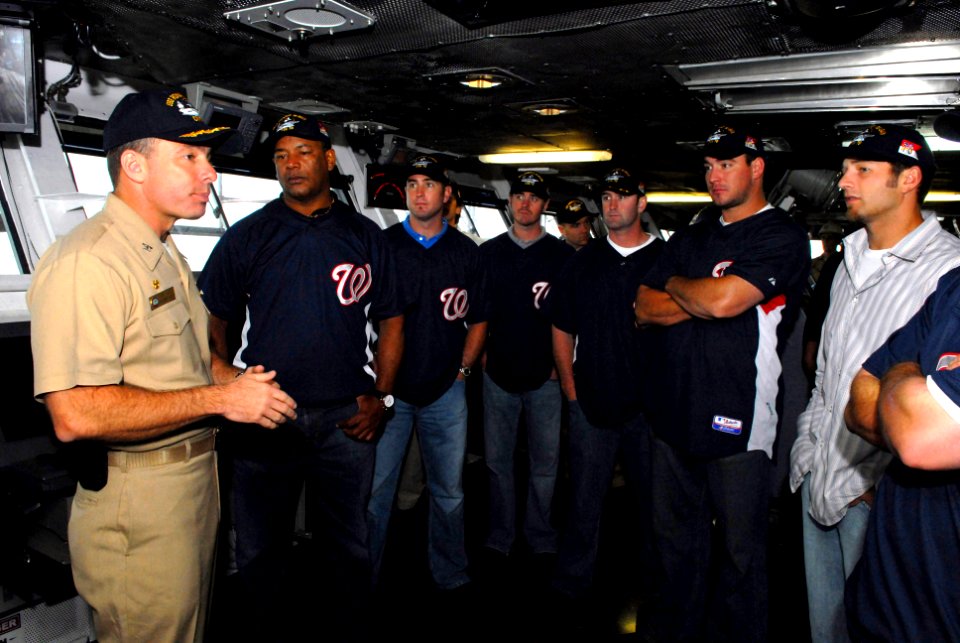 US Navy 070501-N-3659B-179 USS Ronald Reagan (CVN 76) Commanding Officer, Capt. Terry B. Kraft, explains bridge operations to representatives of the Washington Nationals baseball team