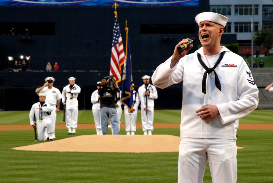 US Navy 070501-N-3659B-381 Intelligence Specialist 2nd Class Jarrod Fowler, from San Bernardino, Calif., sings the National Anthem prior to a San Diego Padres baseball game which honored USS Ronald Reagan (CVN 76)