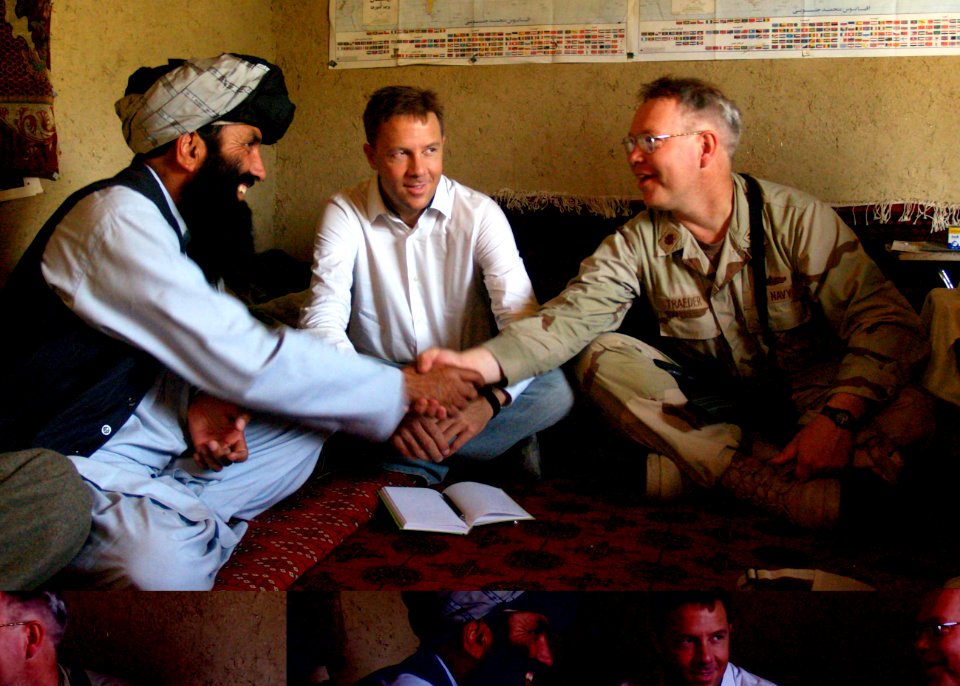 US Navy 070507-N-3385W-001 Lt. Cmdr. Robert Traeder greets district sub-governor of Musa Khel to commemorate the ground breaking of a new district center