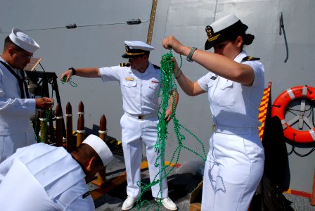 US Navy 070503-N-8273J-172 Sailors aboard USS New Orleans (LPD 18) pass out beads to represent the city of New Orleans during a homeport arrival ceremony for the ship at Naval Base San Diego