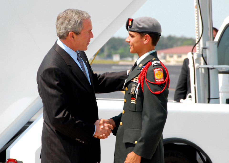 US Navy 070501-N-5783F-007 President George W. Bush shakes hands with 16-year-old junior ROTC member, Daniel Middaugh, upon arrival at MacDill Air Force Base